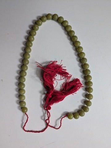 Traditional Green Bead Prayer Mala With Red Silk Tassels - Image 1