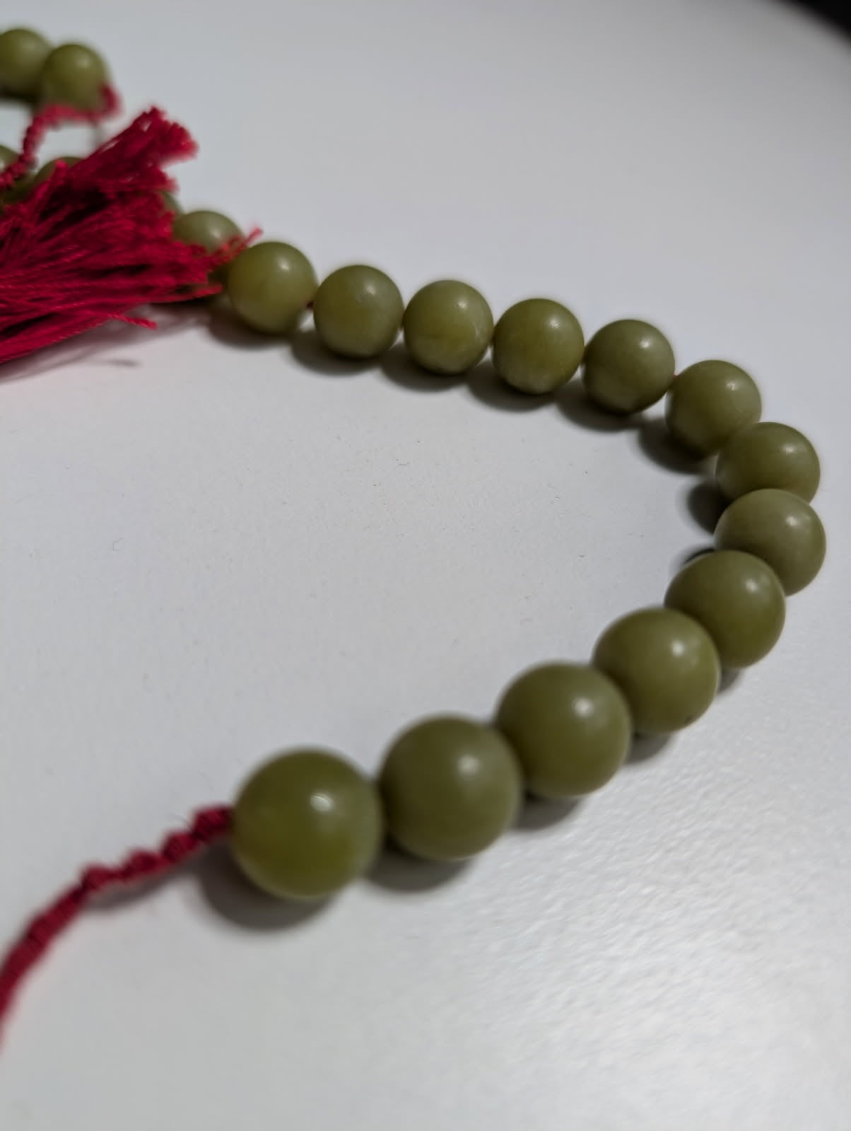 Traditional Green Bead Prayer Mala With Red Silk Tassels - Image 6